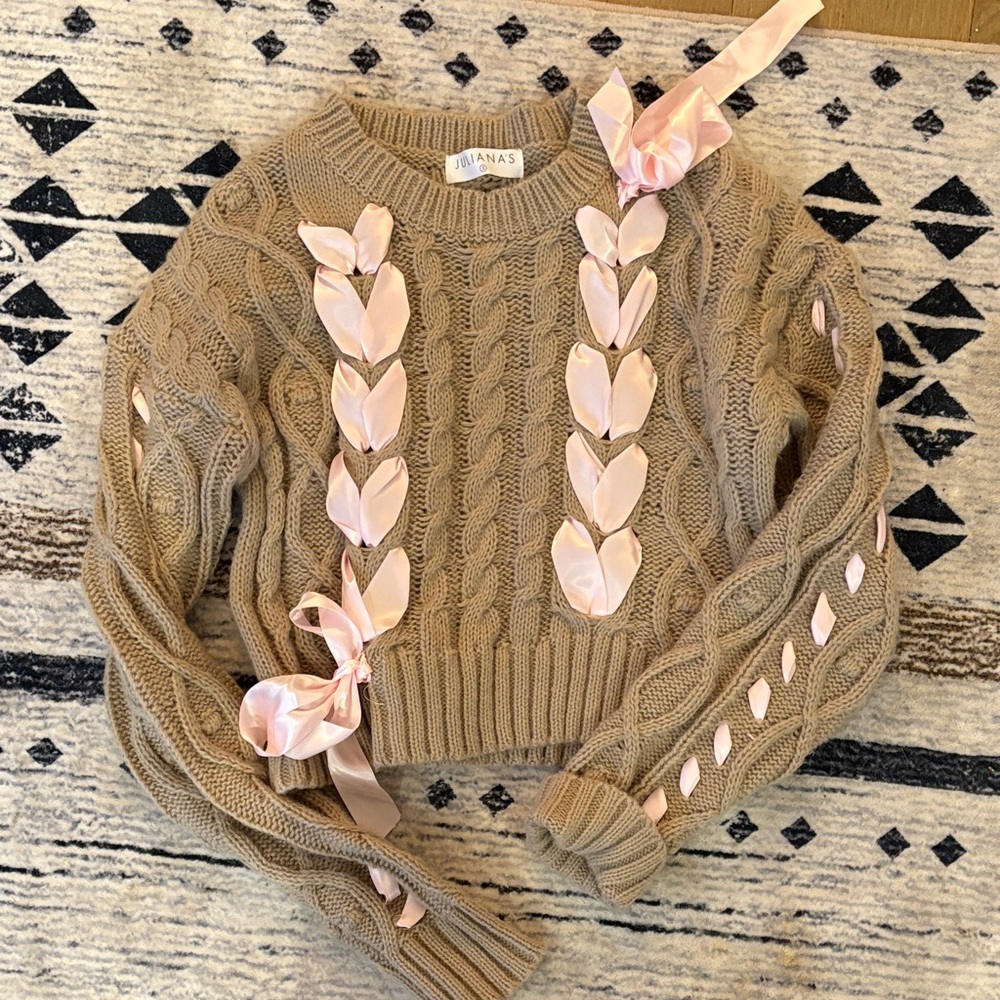 Elegant Cable Knit Sweater with Pink Ribbon Accents